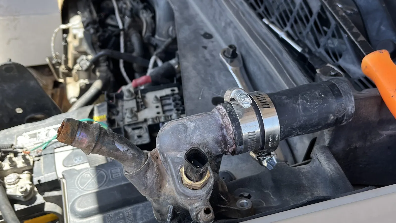 Air conditioning and engine components accessed during an A/C repair at Rio Auto Electric