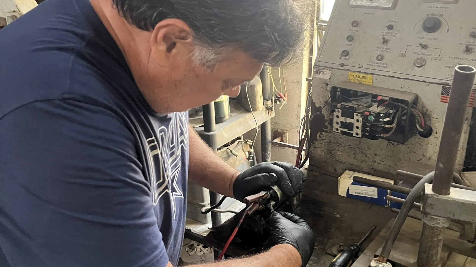 Rey Cavazos bench testing an alternator on the test stand at Rio Auto Electric