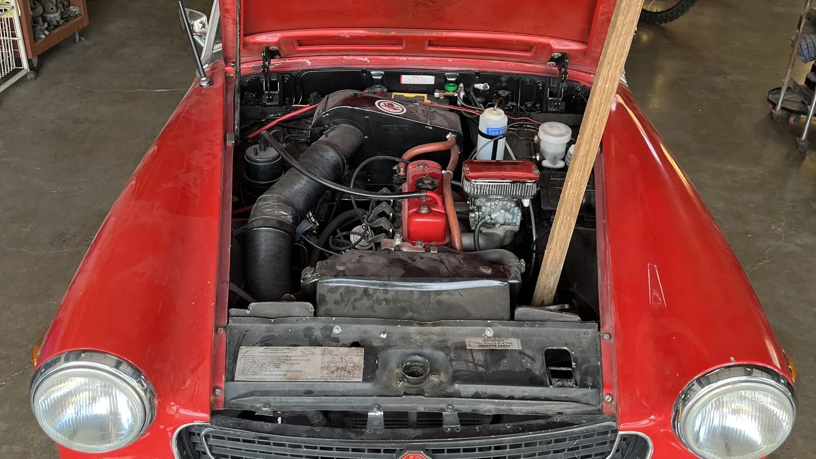 MG Midget engine bay during a classic electrical repair