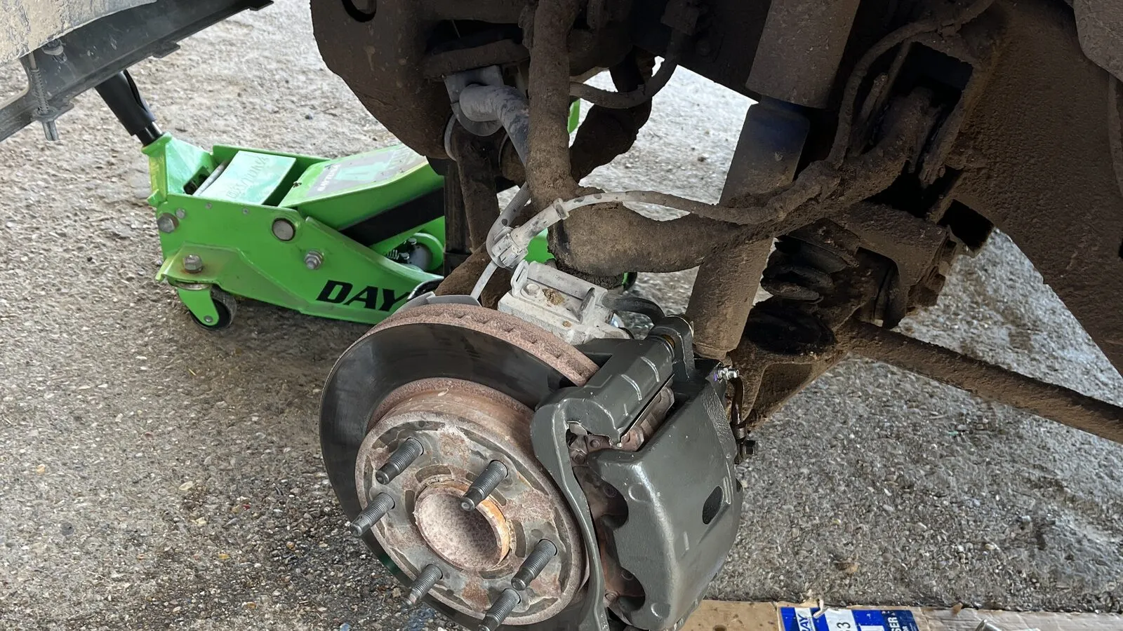 Starter removal from underneath a vehicle on jack stands